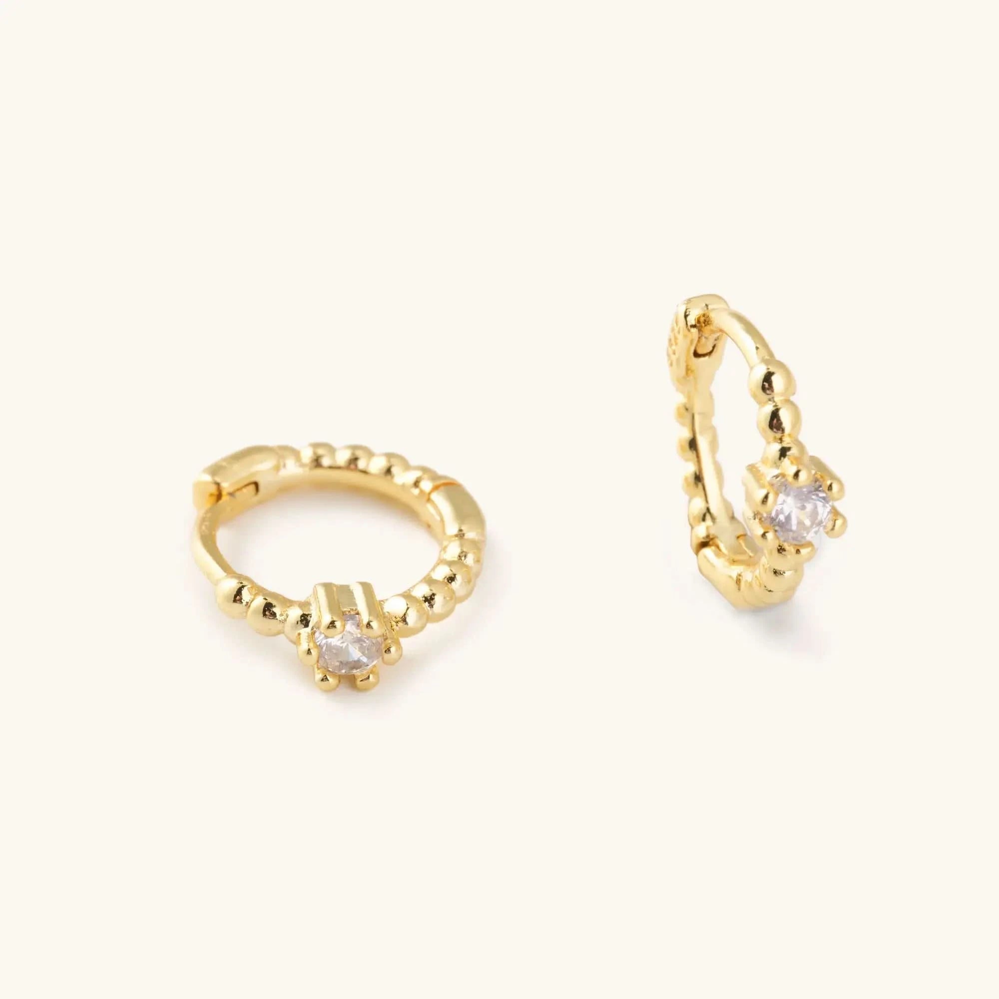 Waterproof gold huggie earrings with single Crystal gem