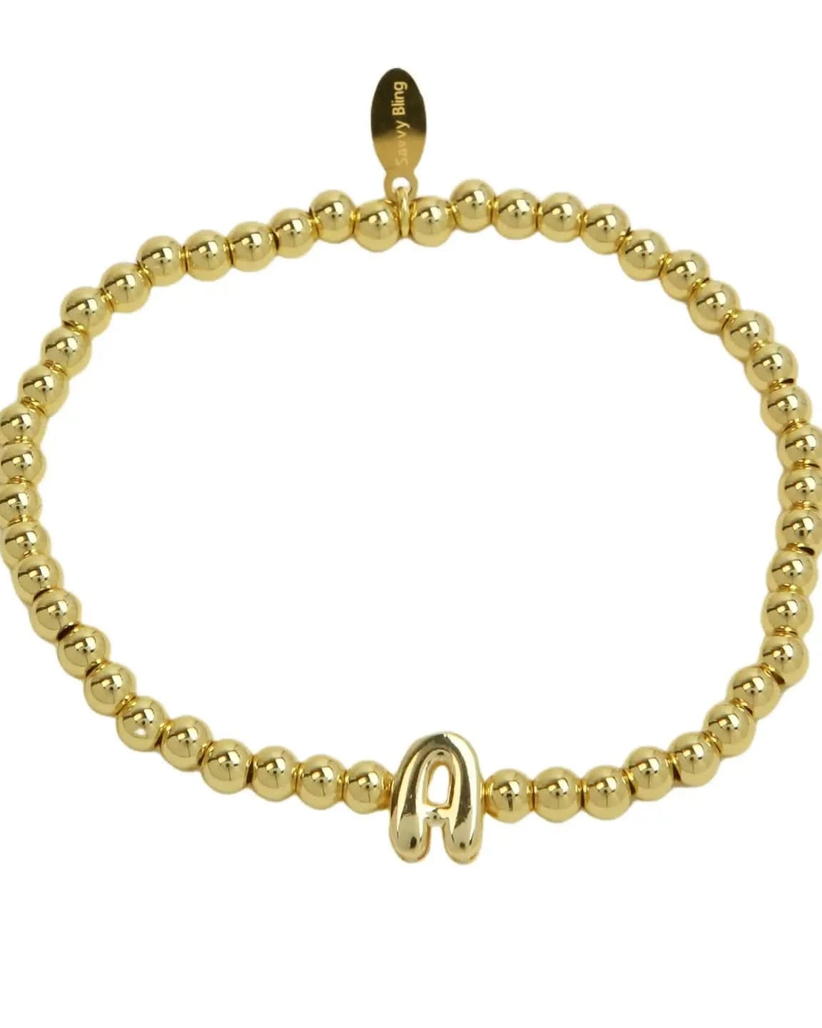 Gold beaded bracelet with a clasp on a white background