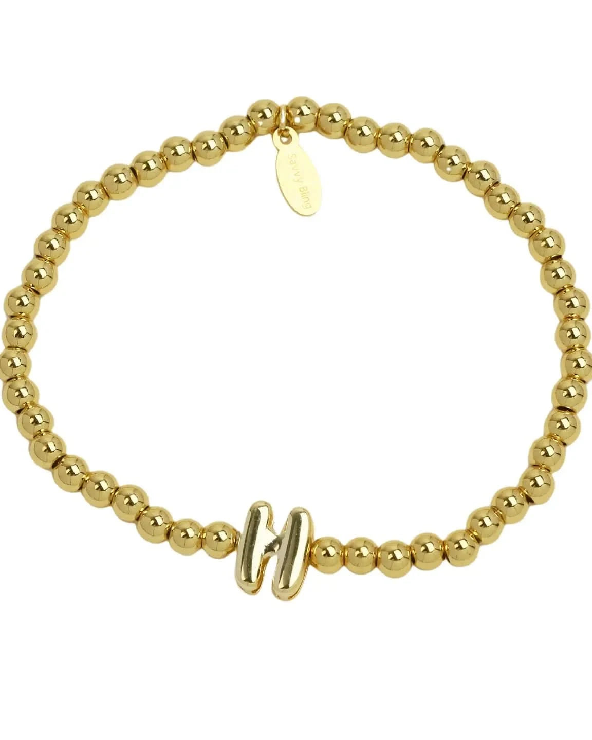 Gold beaded bracelet with a clasp on a white background