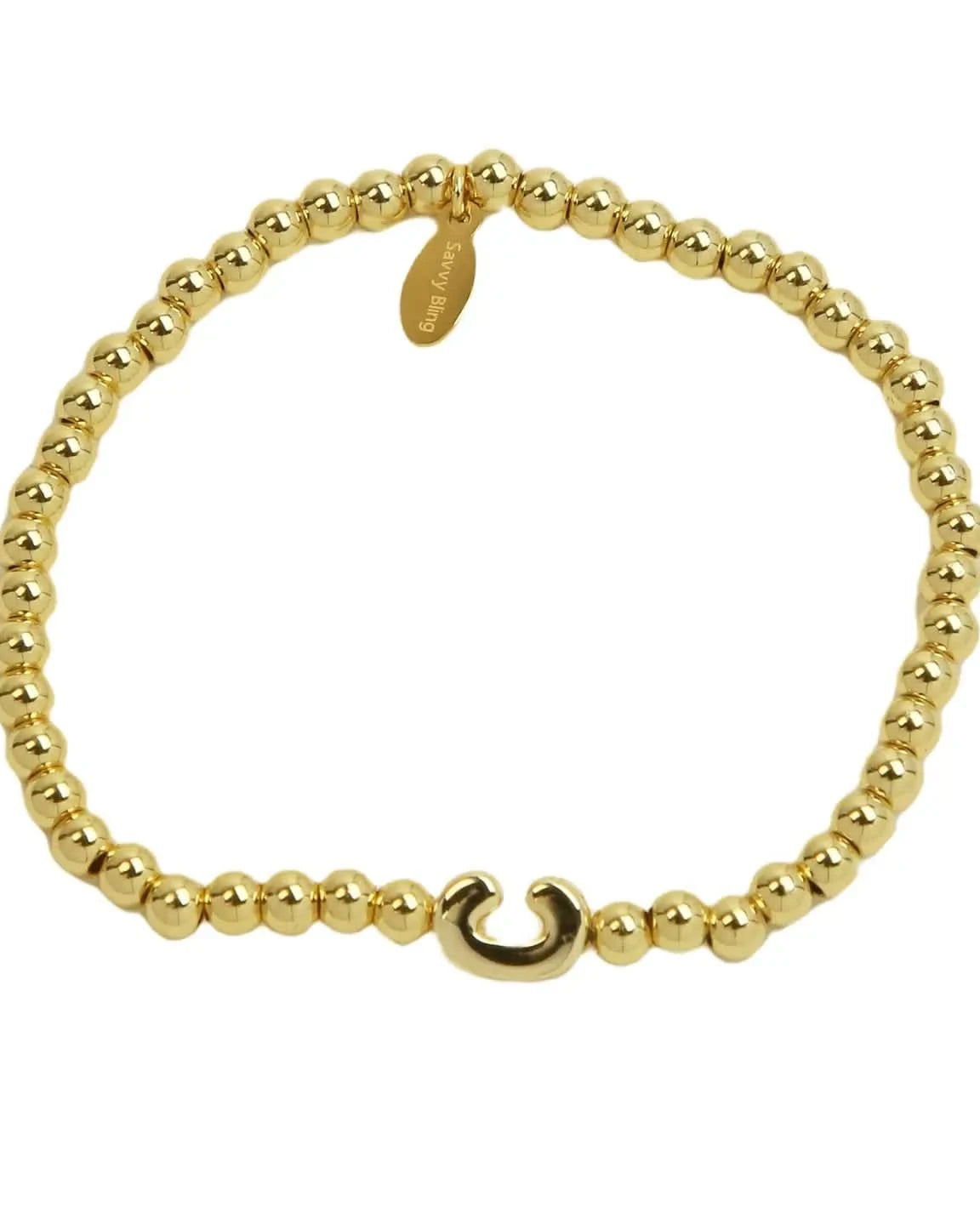 Gold beaded bracelet with a hook clasp on a white background