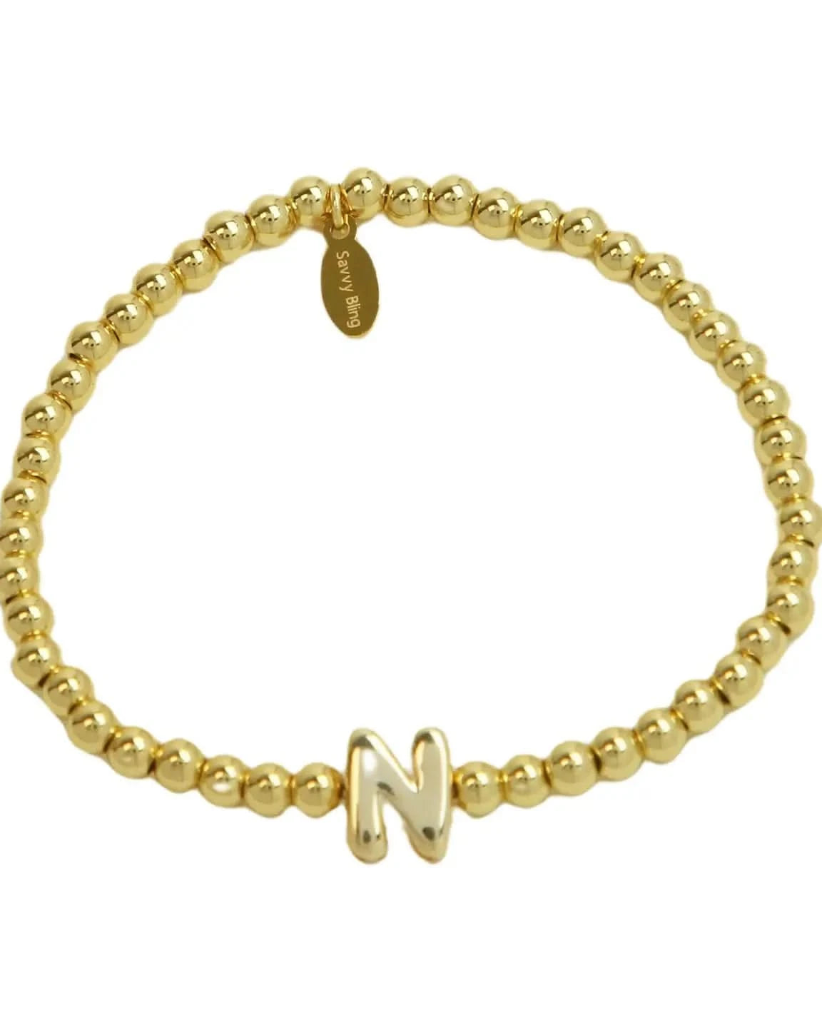 Gold beaded bracelet with a gold letter 'N' charm on a white background