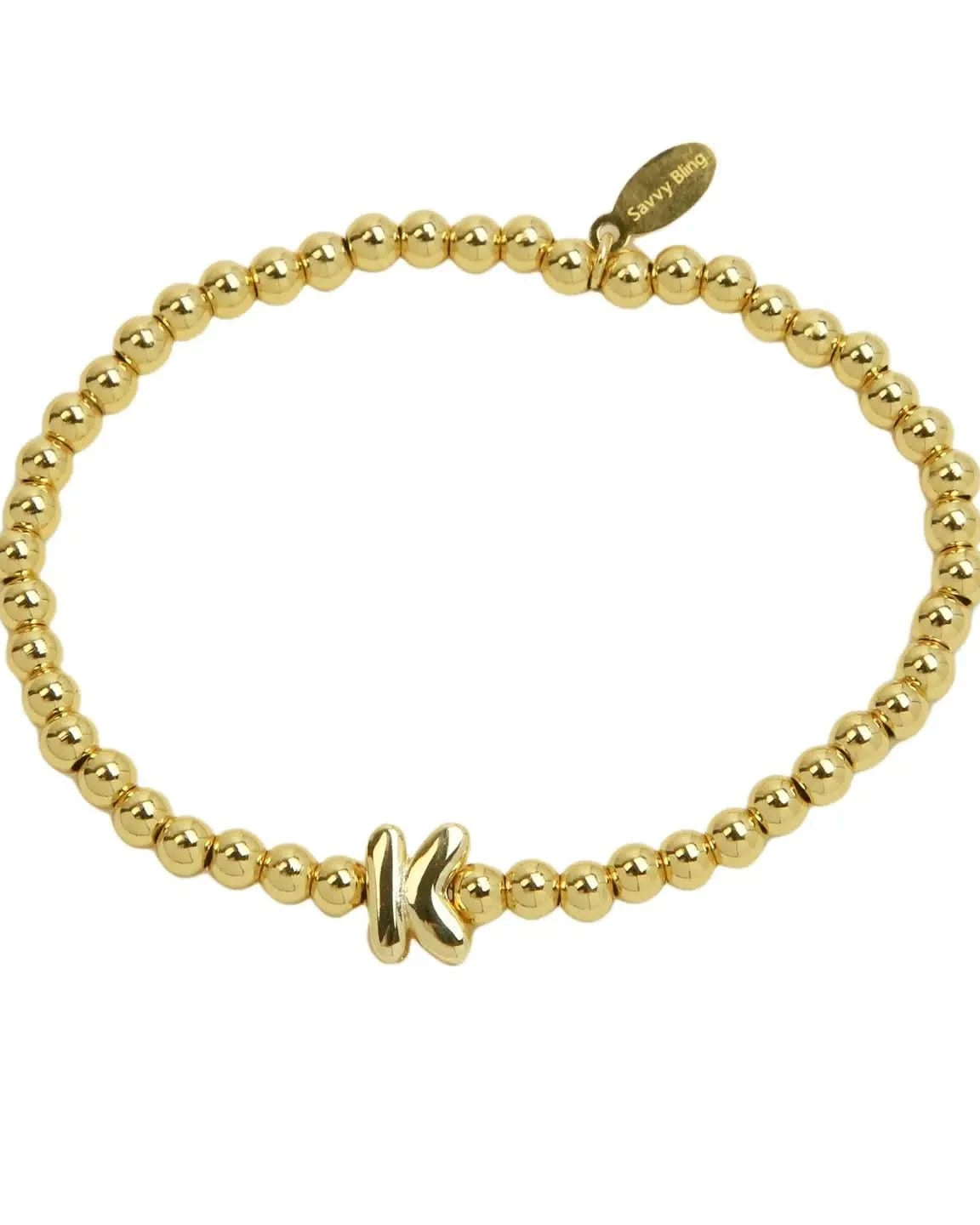 Gold beaded bracelet on a white background