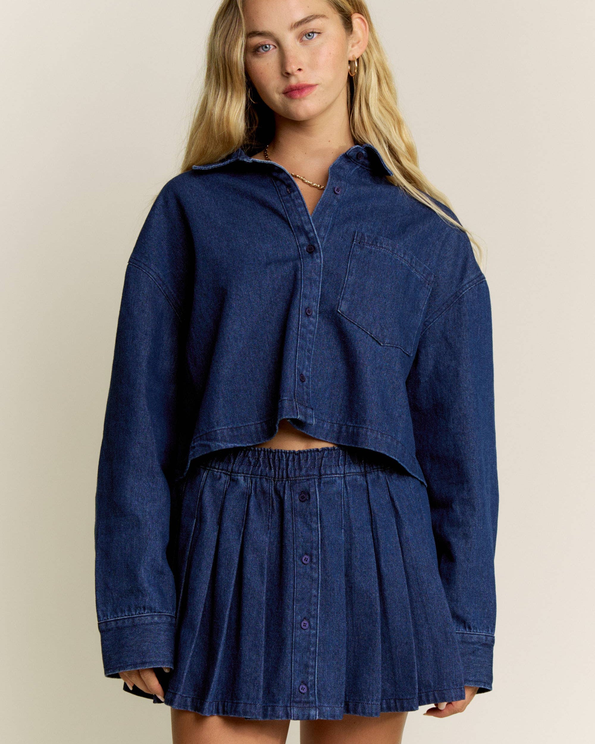 classic denim look, this pleated skort combines the style of a mini skirt