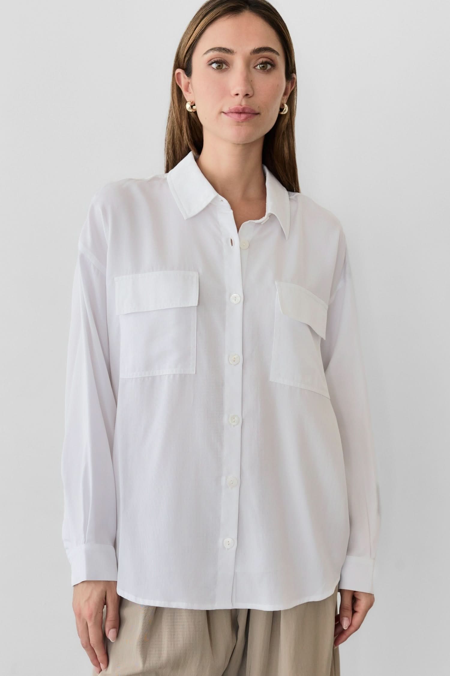 woman wearing white oversized classic button-down shirt