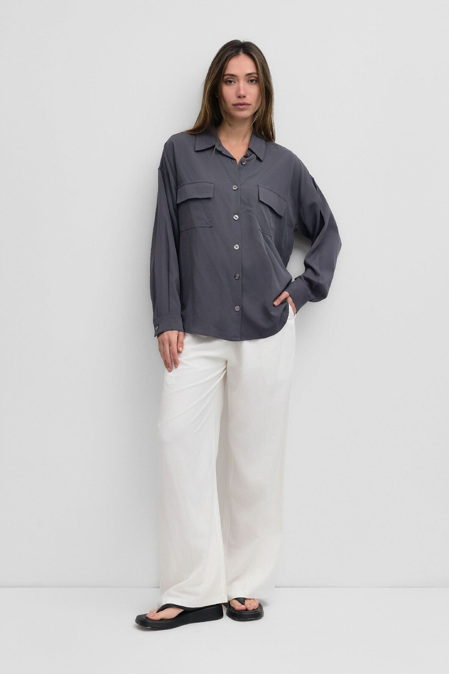woman wearing dark grey blue oversized classic button-down shirt