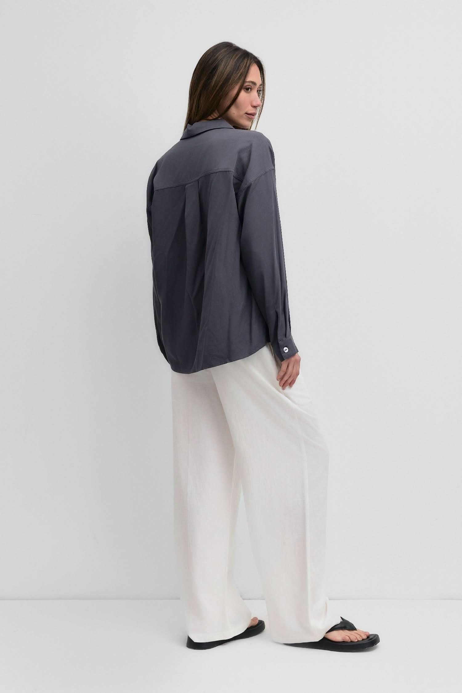 woman wearing dark grey blue oversized classic button-down shirt