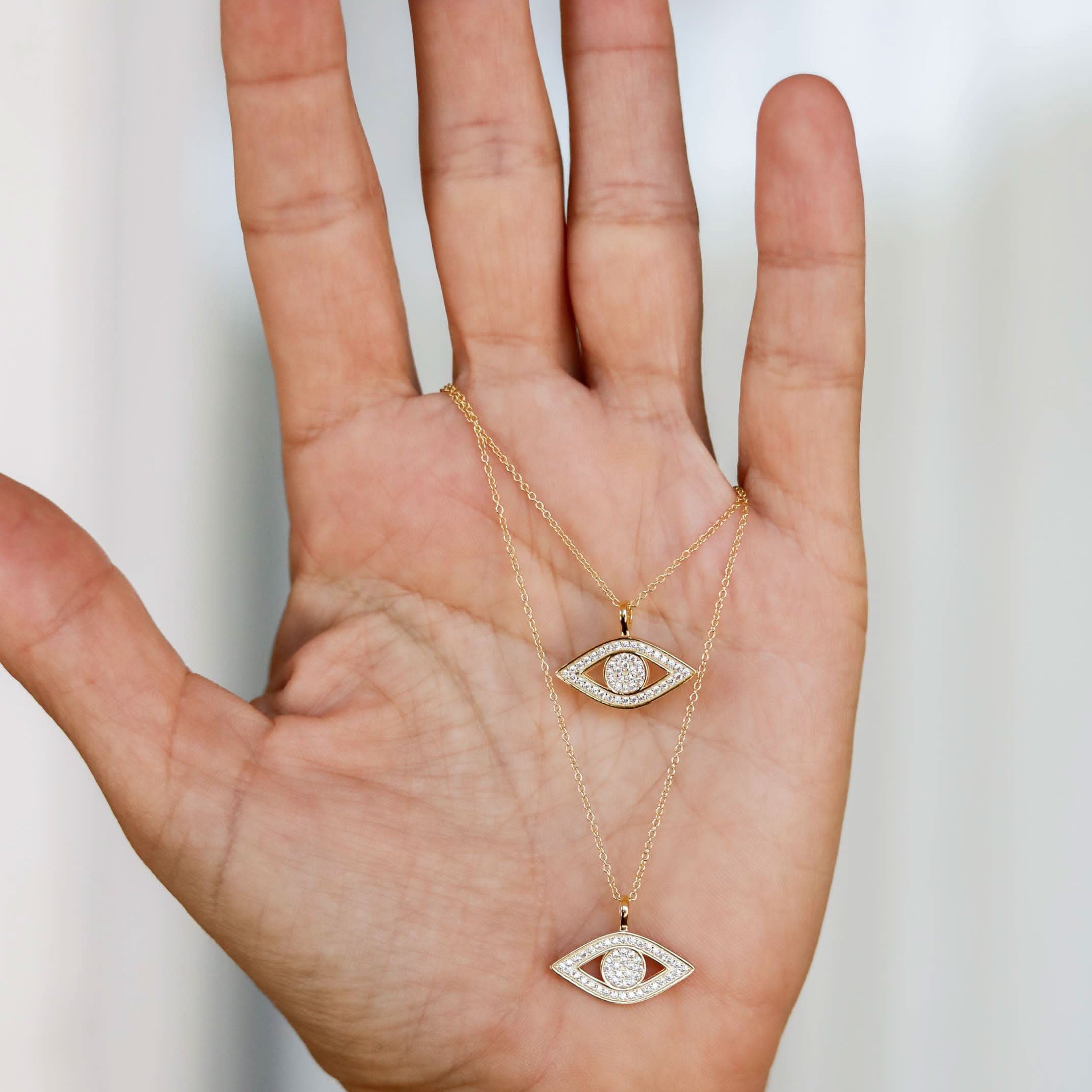 Two gold necklaces with eye-shaped pendants CZ Evil Eye Necklace two