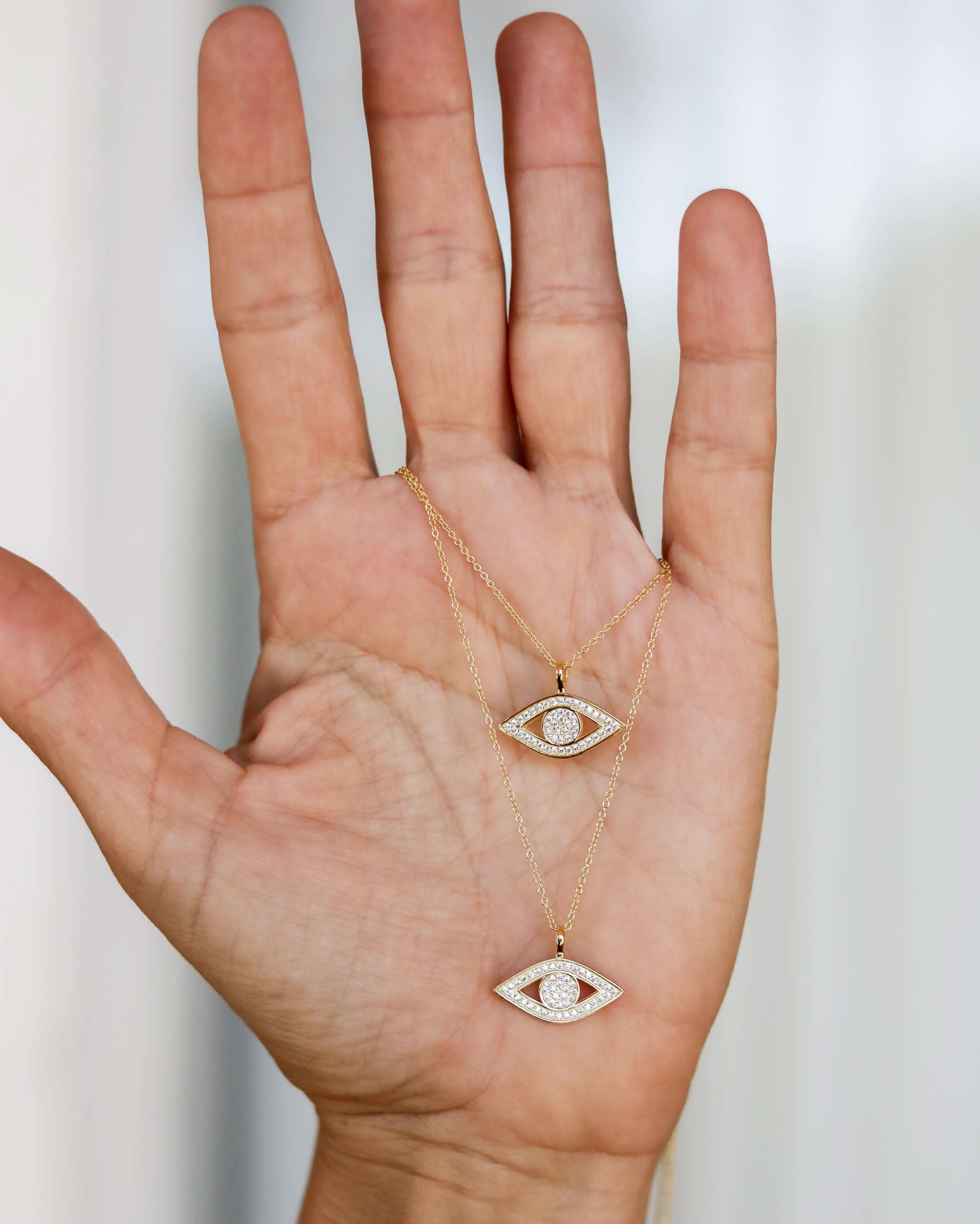 Two gold necklaces with eye-shaped pendants CZ Evil Eye Necklace two