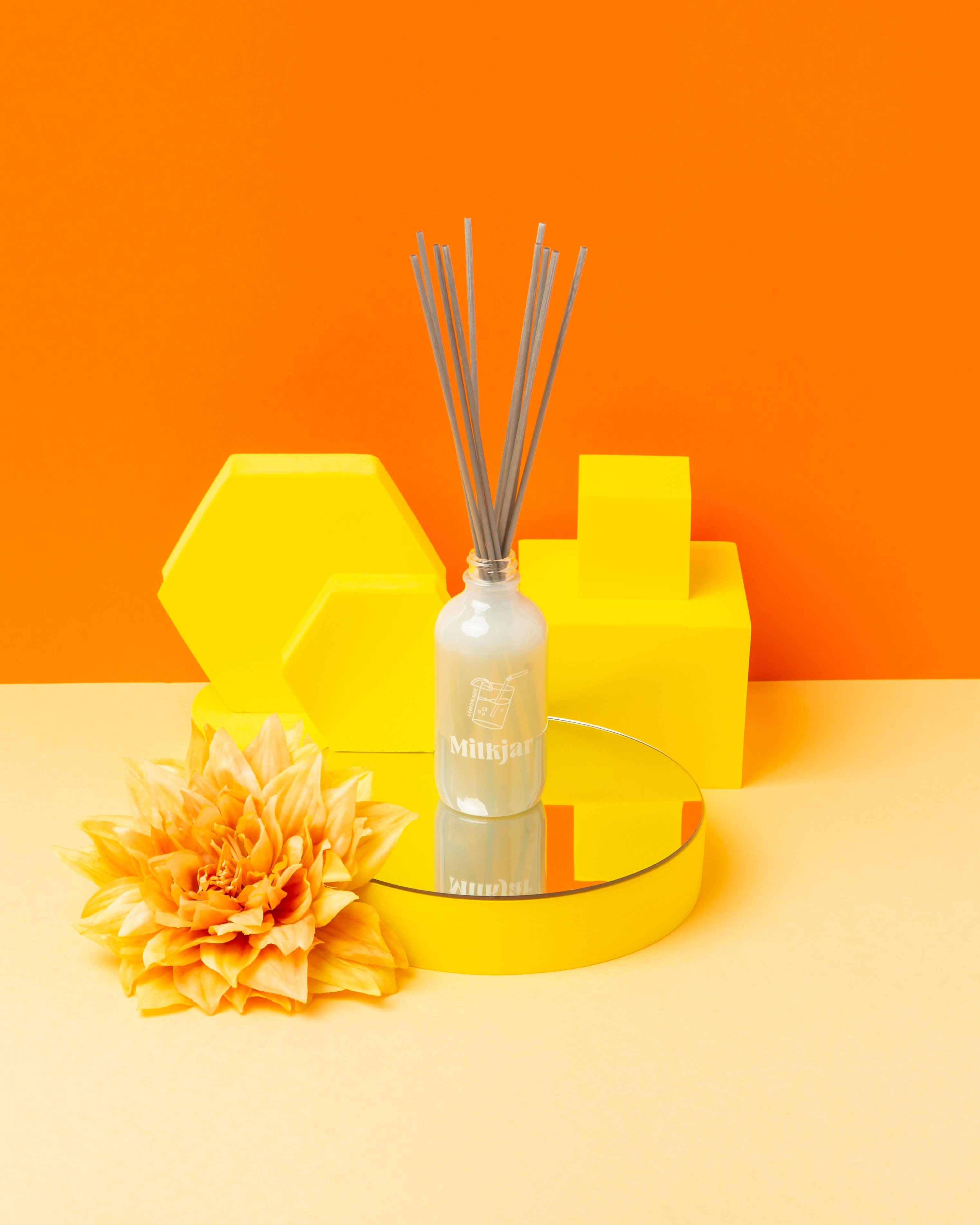 aesthetically pleasing glass Reed diffuser with honey comb and flowers