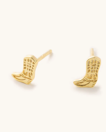 Gold cowboy boot earrings on a white background