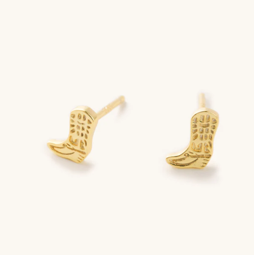 Gold cowboy boot earrings on a white background