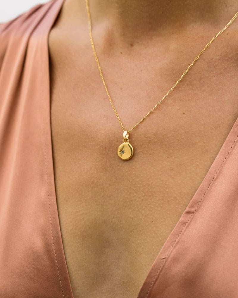 wearing Polaris the north star crystal stone gold necklace