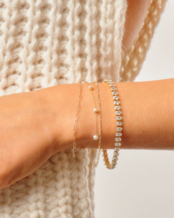 Woman wearing 7 inch cubic z cushion cut tennis bracelet