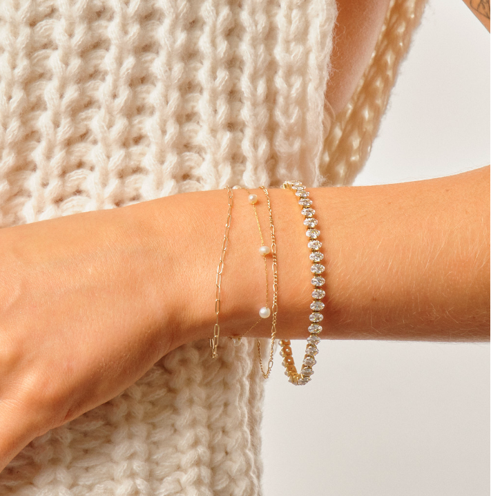 Woman wearing 7 inch cubic z cushion cut tennis bracelet