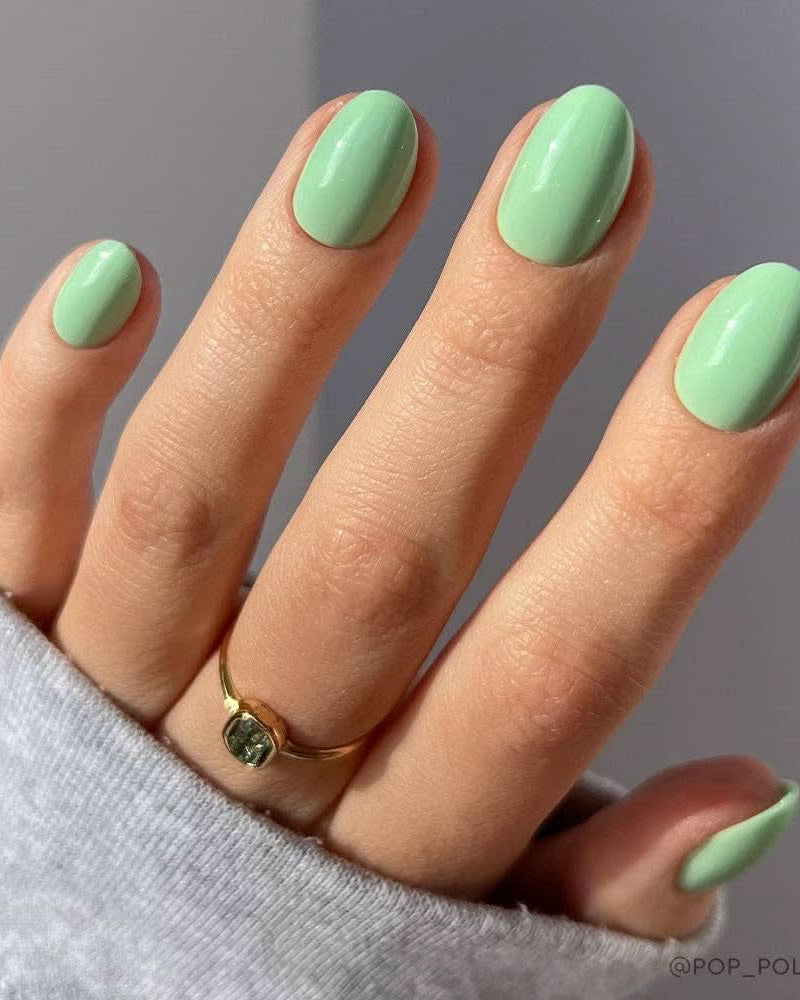 Azure Blue press-on nails worn on short natural nails – styled / hands on display