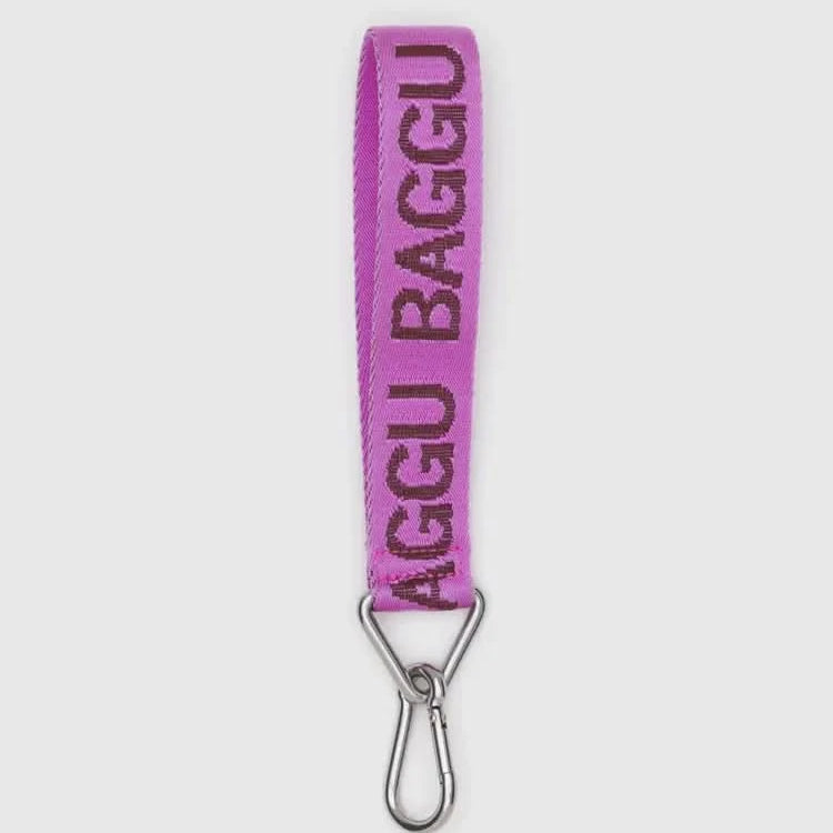 Purple baggu strap with metal clip on a white background