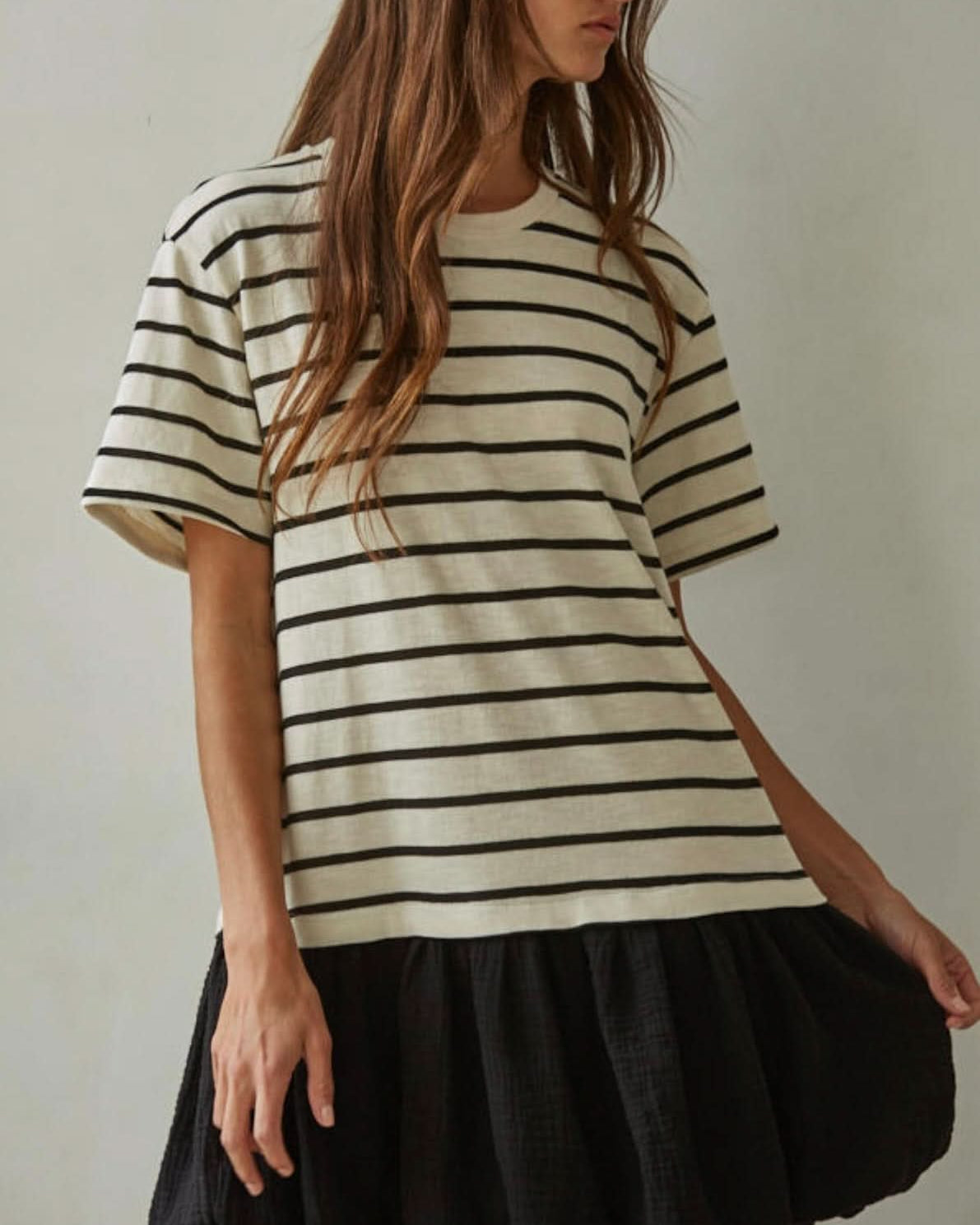 Woman wearing a striped dress white and black line design