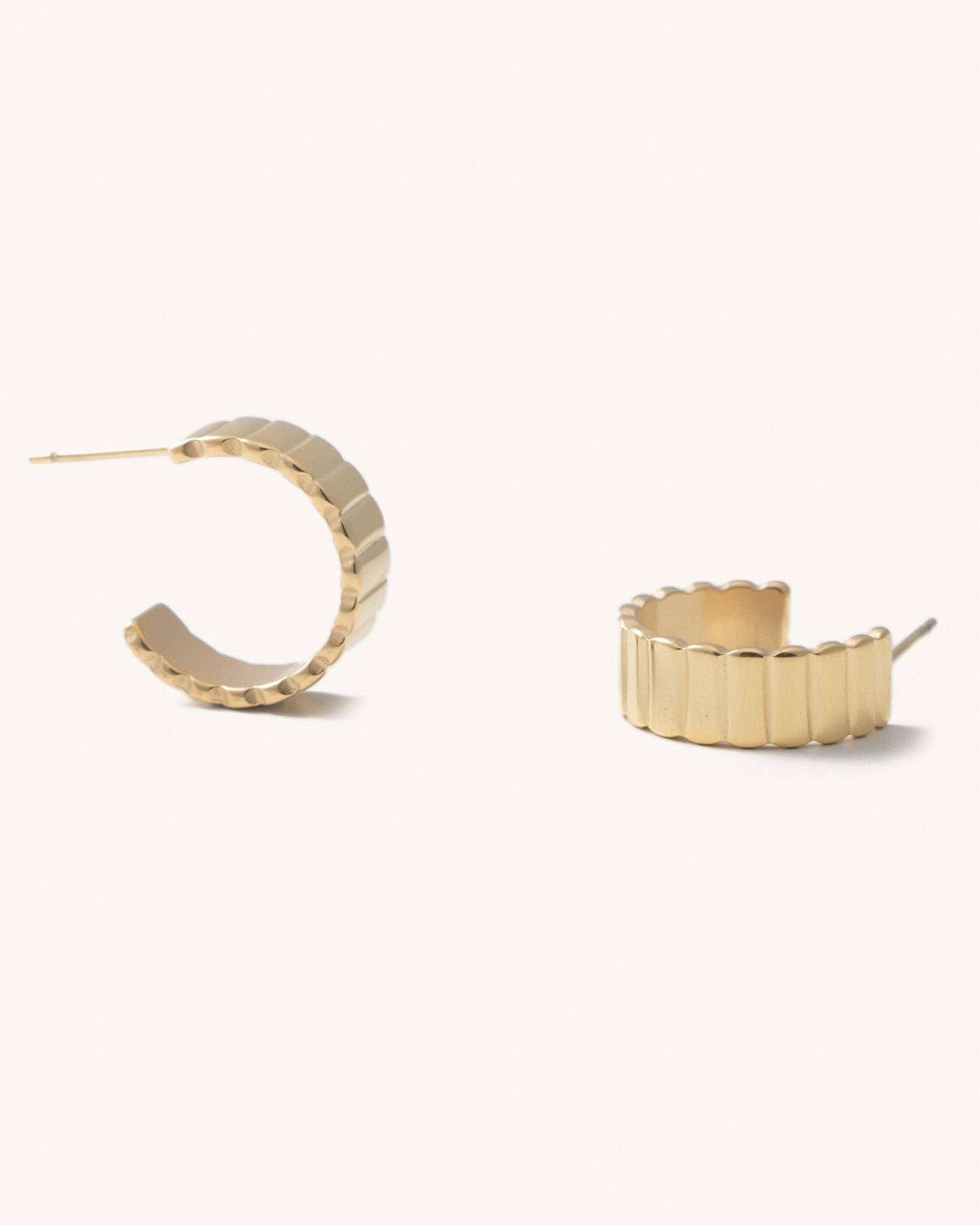 Dylan Ridged Gold Hoop Earrings Ridged hoop earrings laying