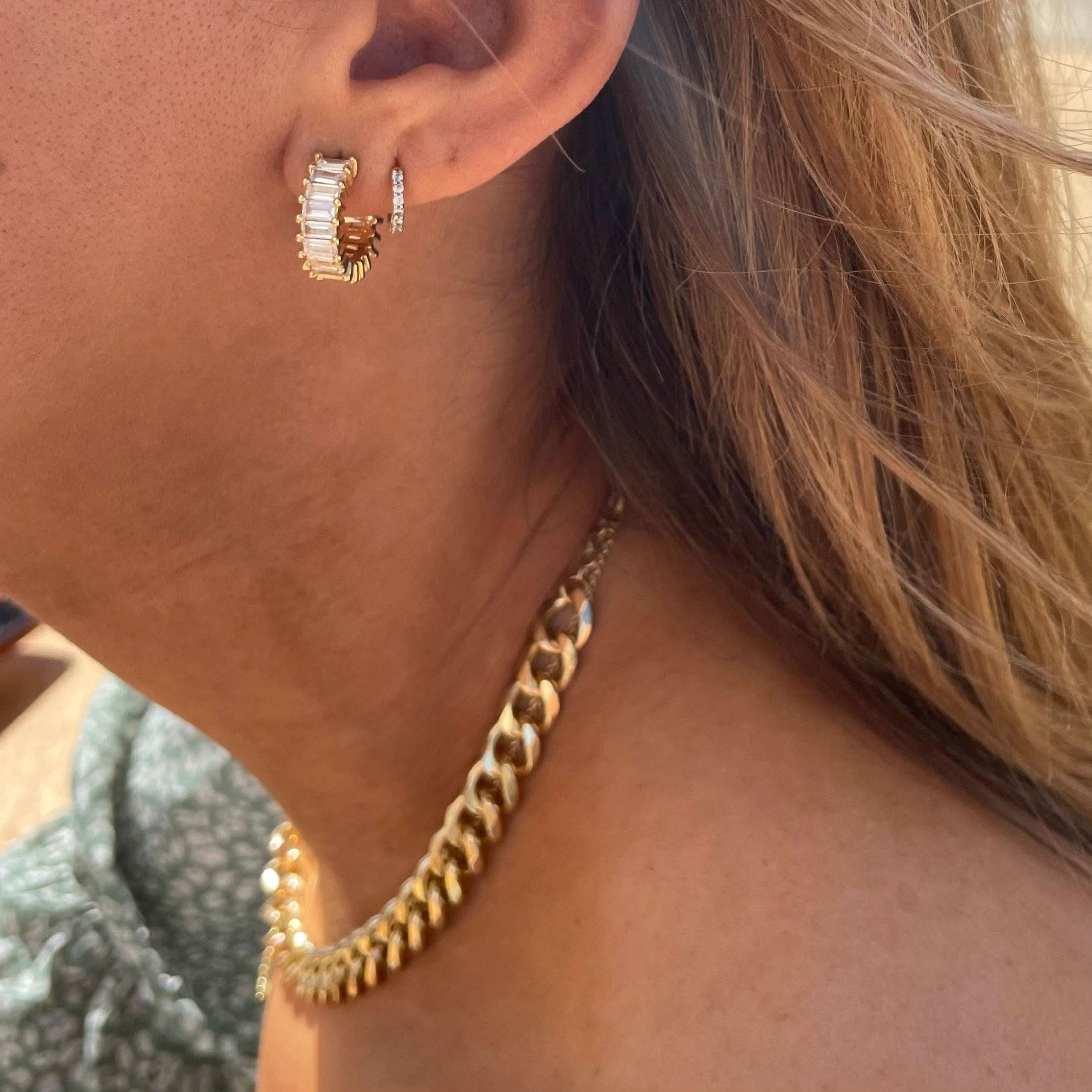 Woman wearing Gold diamond hoop earrings