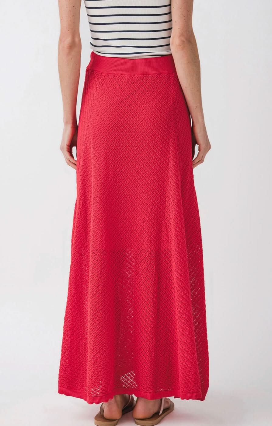 wearing knit red skirt with diamond geometrical pattern and front tie