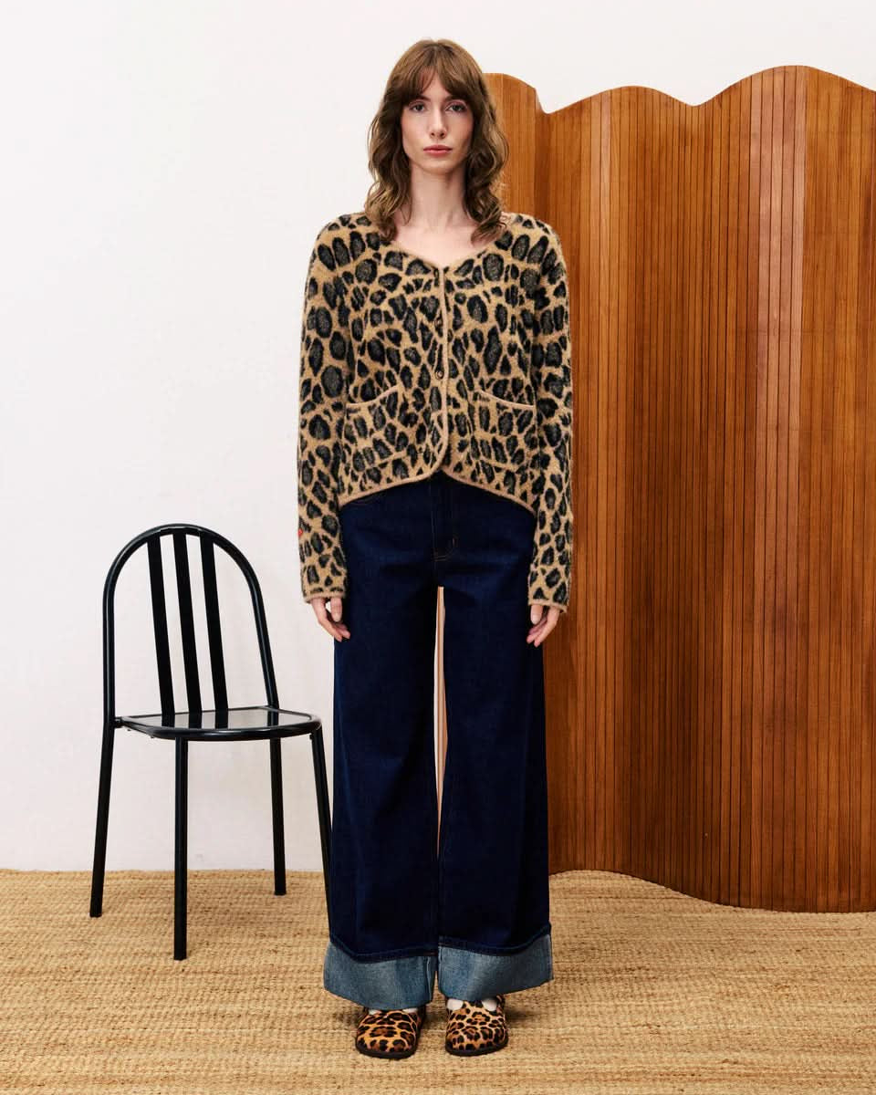 Person wearing a leopard print tFRNCH Leopard Begonia Cardigan