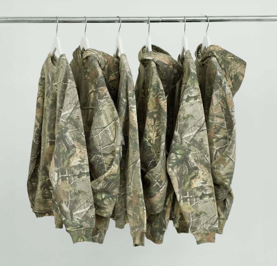 Six Vintage camo real tree cotton pullover hoodie sweatshirts hanging on hangers