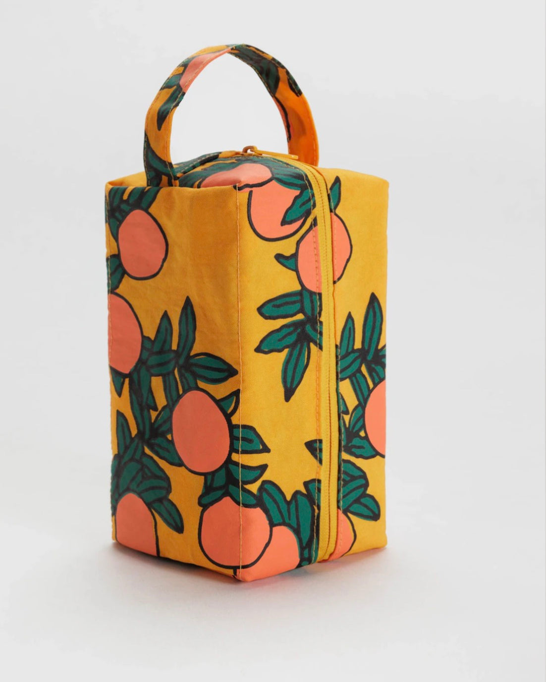 Yellow rectangular bag with orange and green fruit pattern on a white background