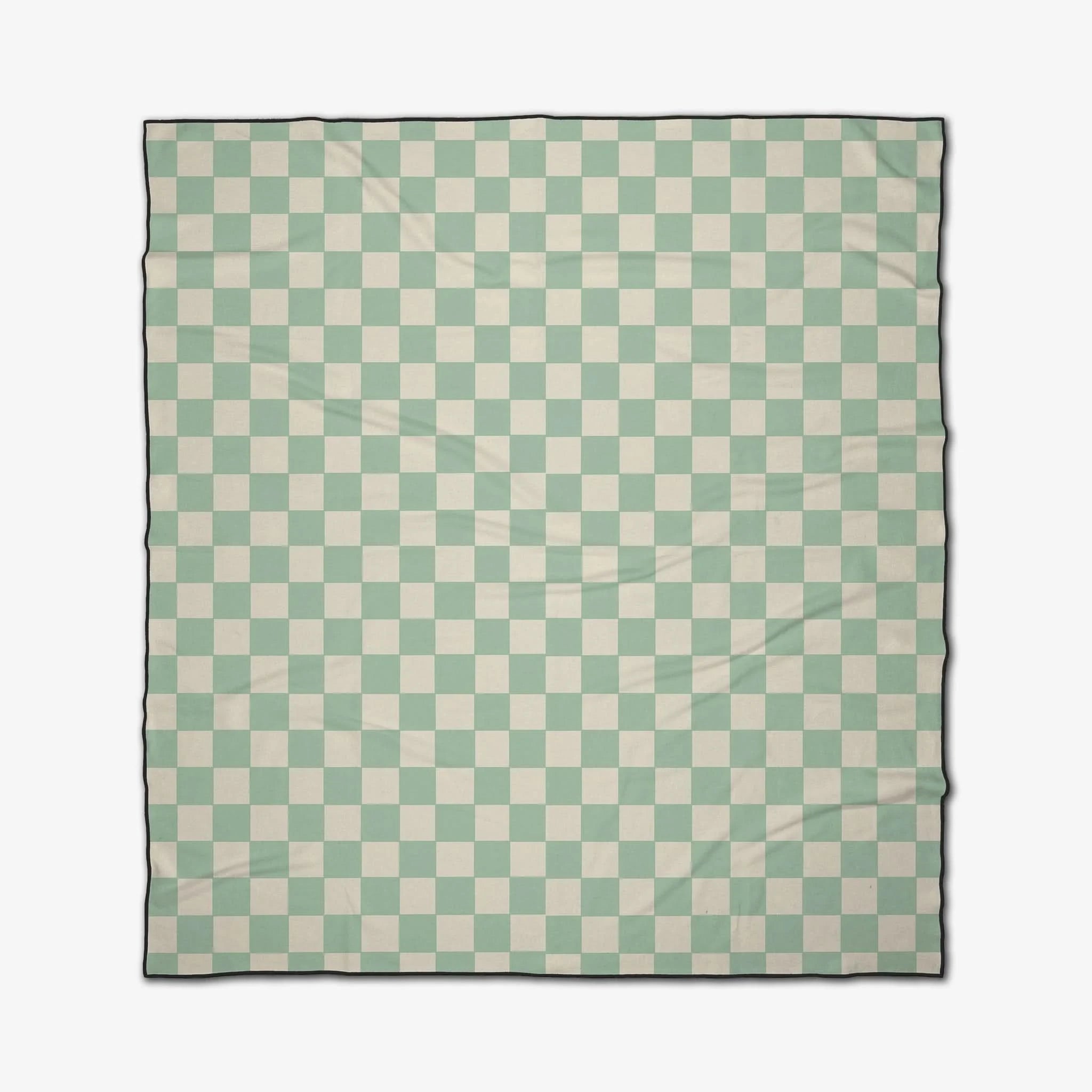 Checkered blanket with green and white pattern on a white background