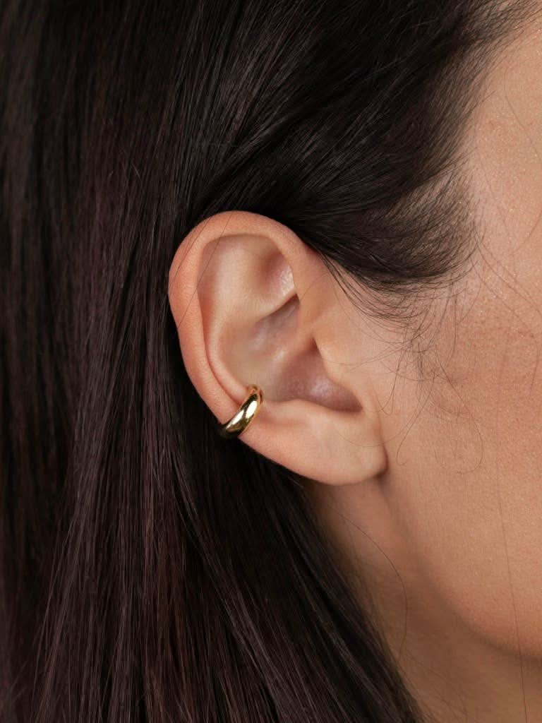 Gold Cuff Earrings woman wearing gold earring smooth cuff