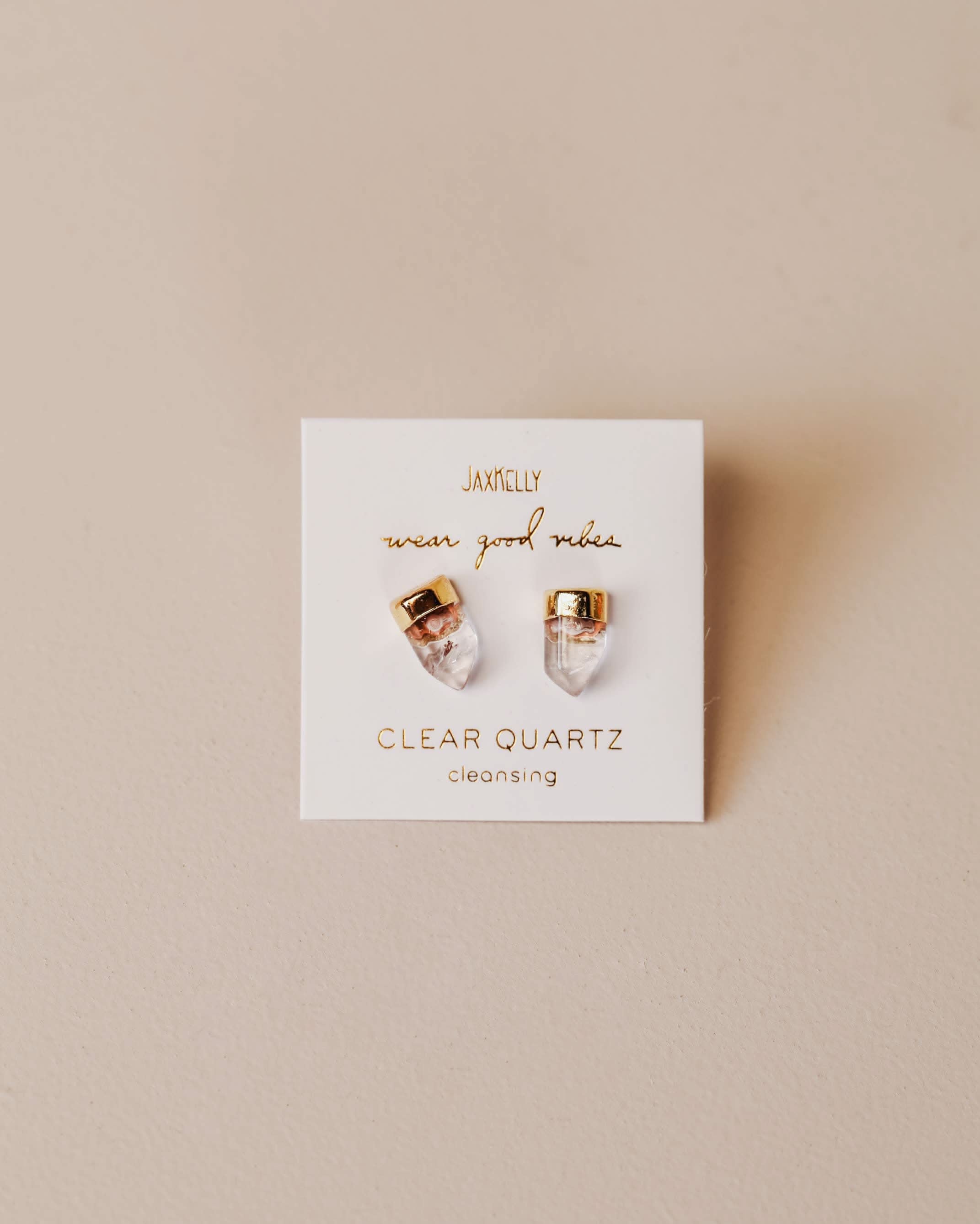 Clear quartz earrings on a branded card with 'Jewelry Wear Good Vibes'