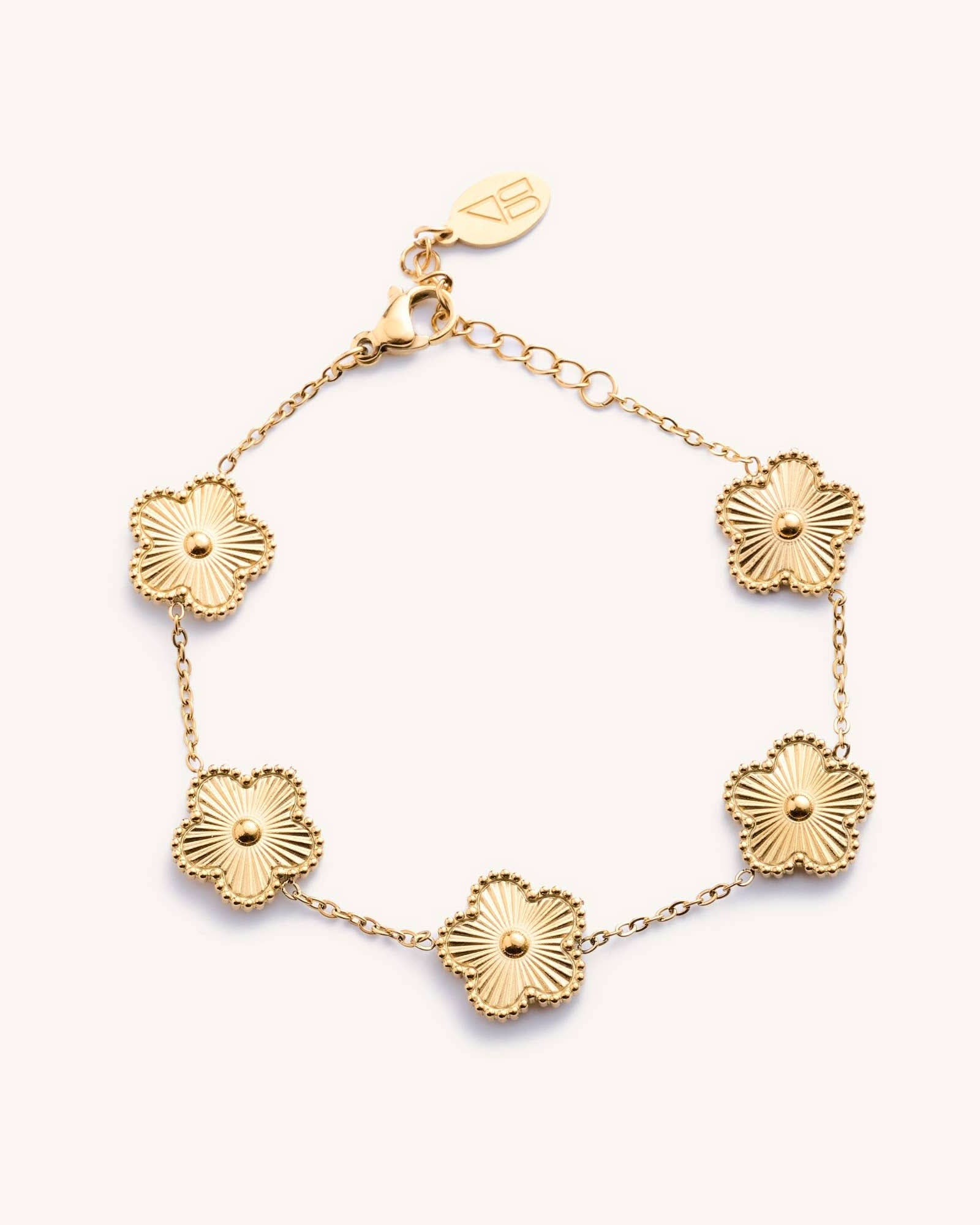 Gold bracelet with floral designs