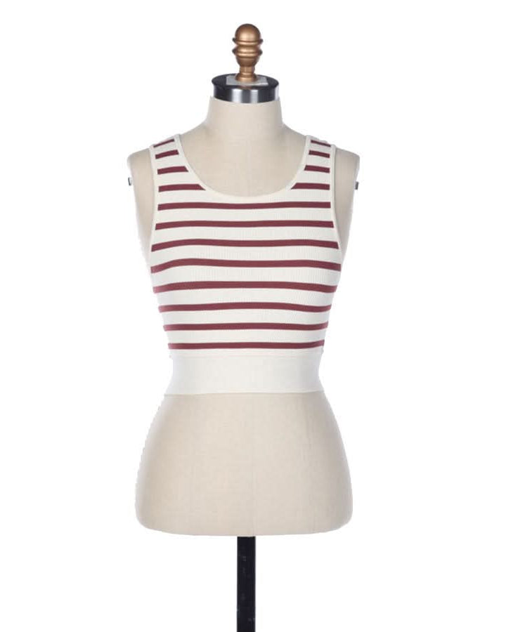 A crème and red striped sleeveless U-V neckline tank top in front of a blank background.