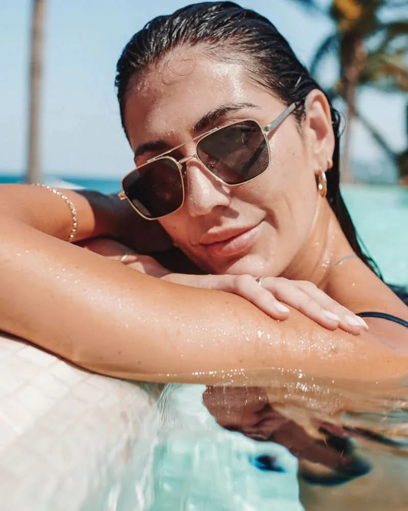 Woman wearing aviator style sunglasses