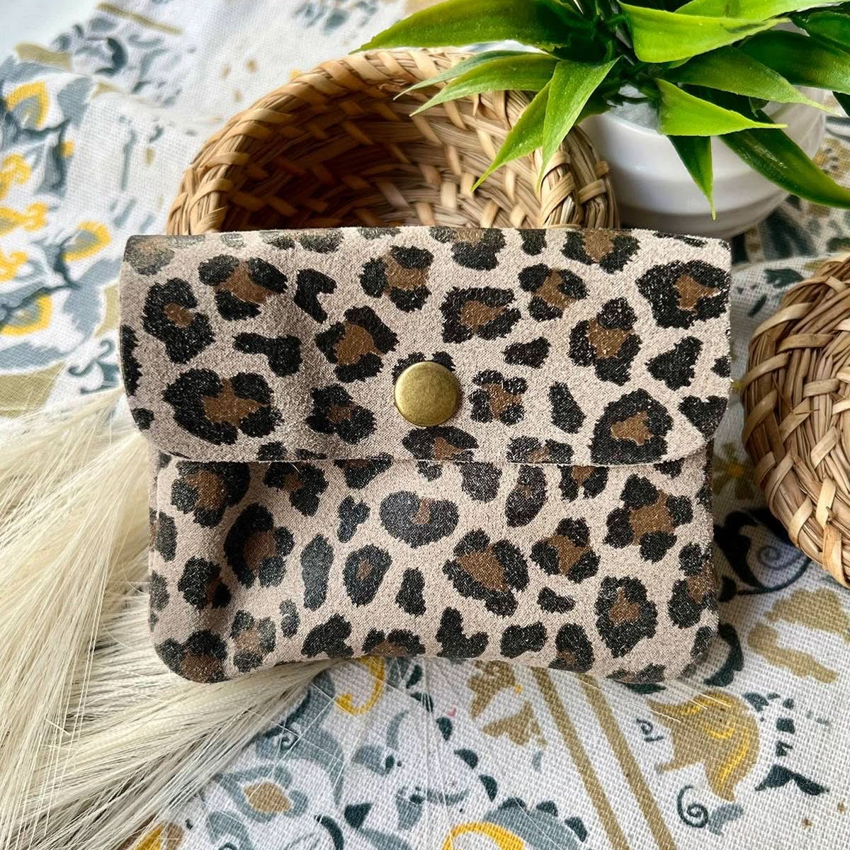 Small taupe leopard print metal wallet with over flap and gold button clasp