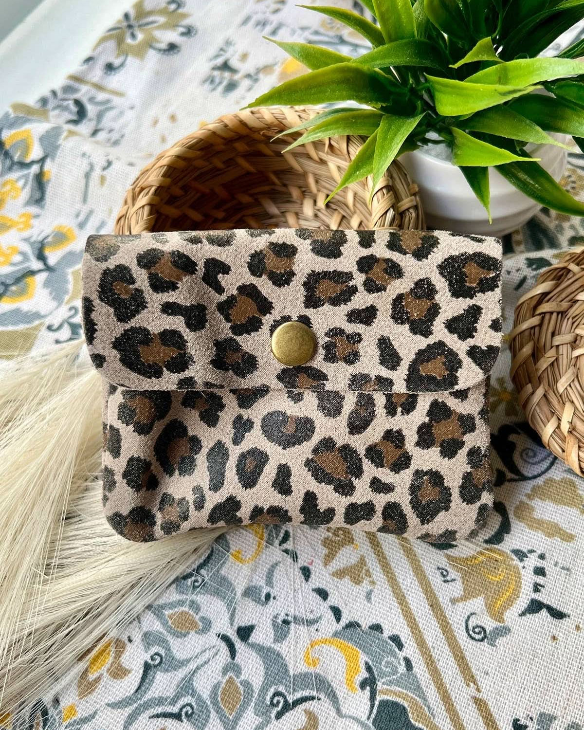 Small taupe leopard print metal wallet with over flap and gold button clasp