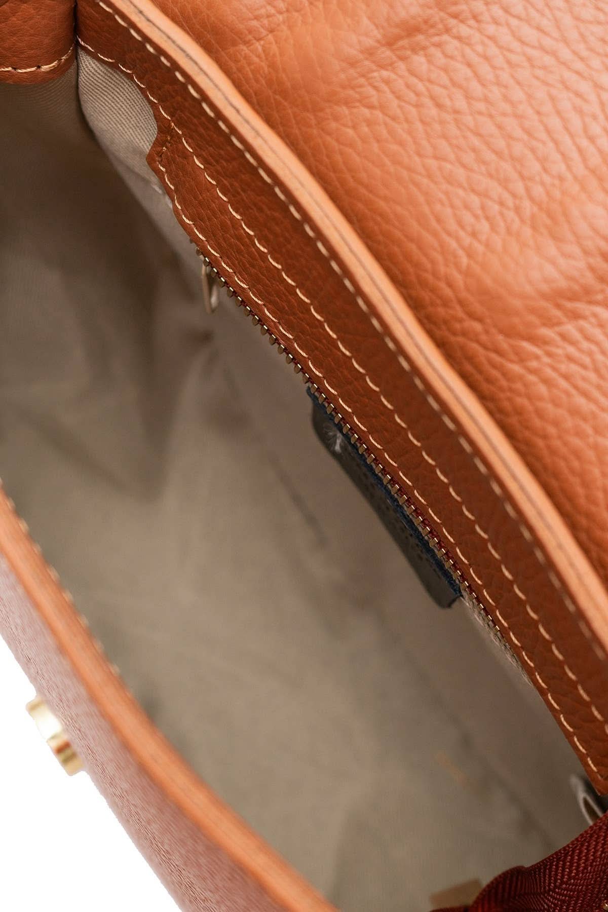 Chestnut brown colored leather crossbody bag with magnetic front clap and leather woven geometric design and gold Metal details