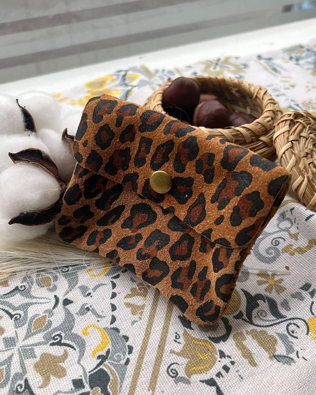 Chestnut brown leopard wallet with metal button clasp