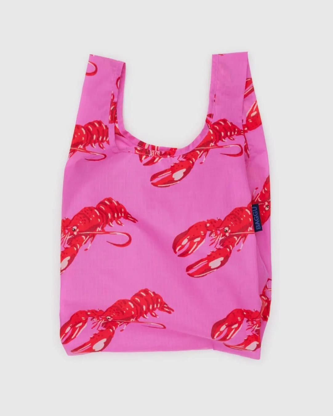 reuseable, foldable pink baby baggu bag depicting red lobsters all over the bag