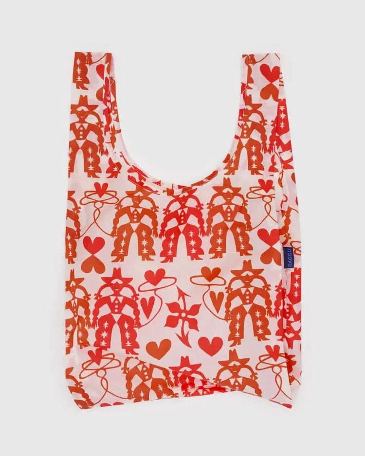Pinkish white baby baggu reuseable grocery bag with red cowgirl print throughout the bag