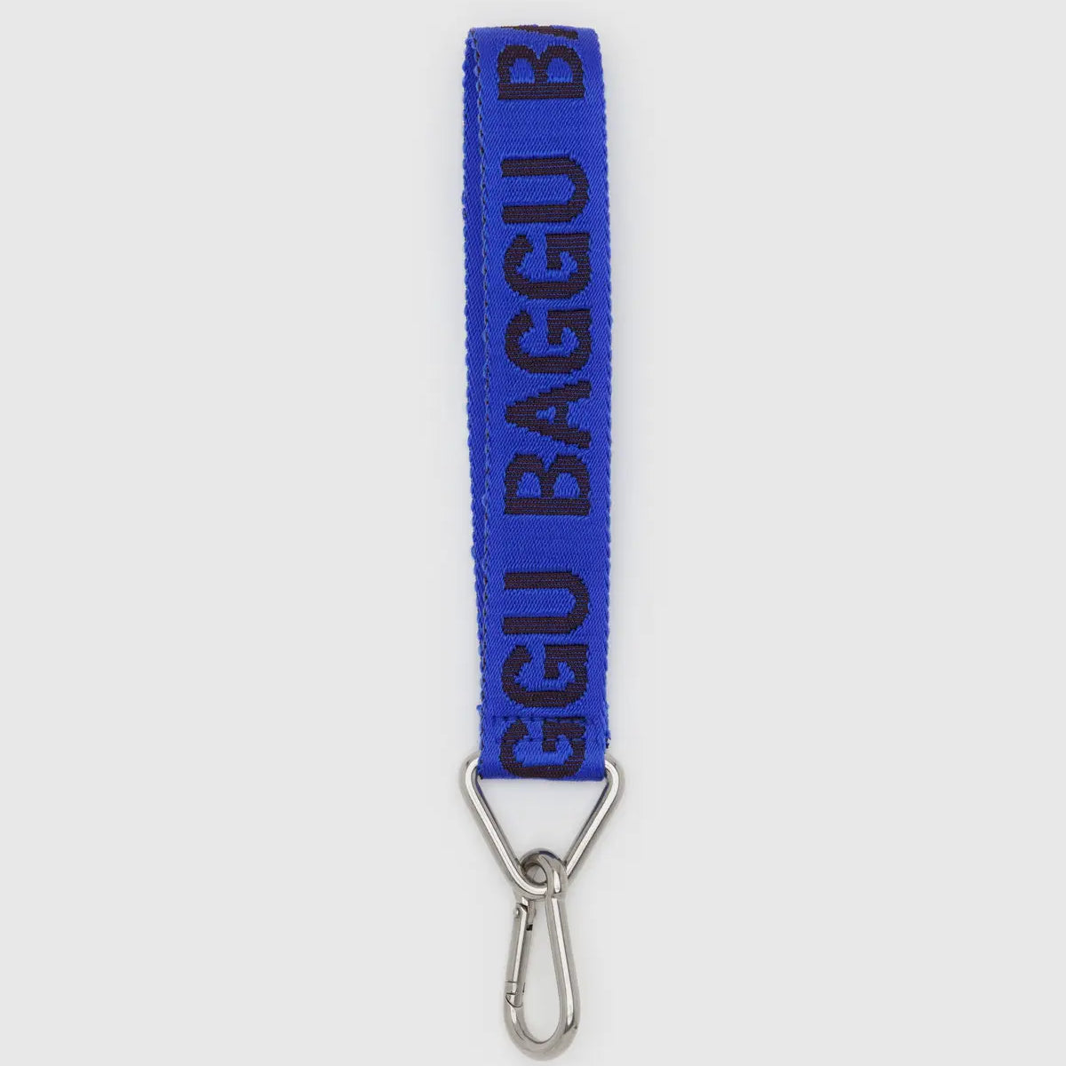 Blue baggu strap with metal clip on a white background