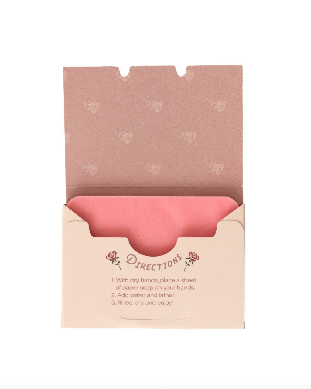 Pink paper soap sheet in an open beige box on a white background
