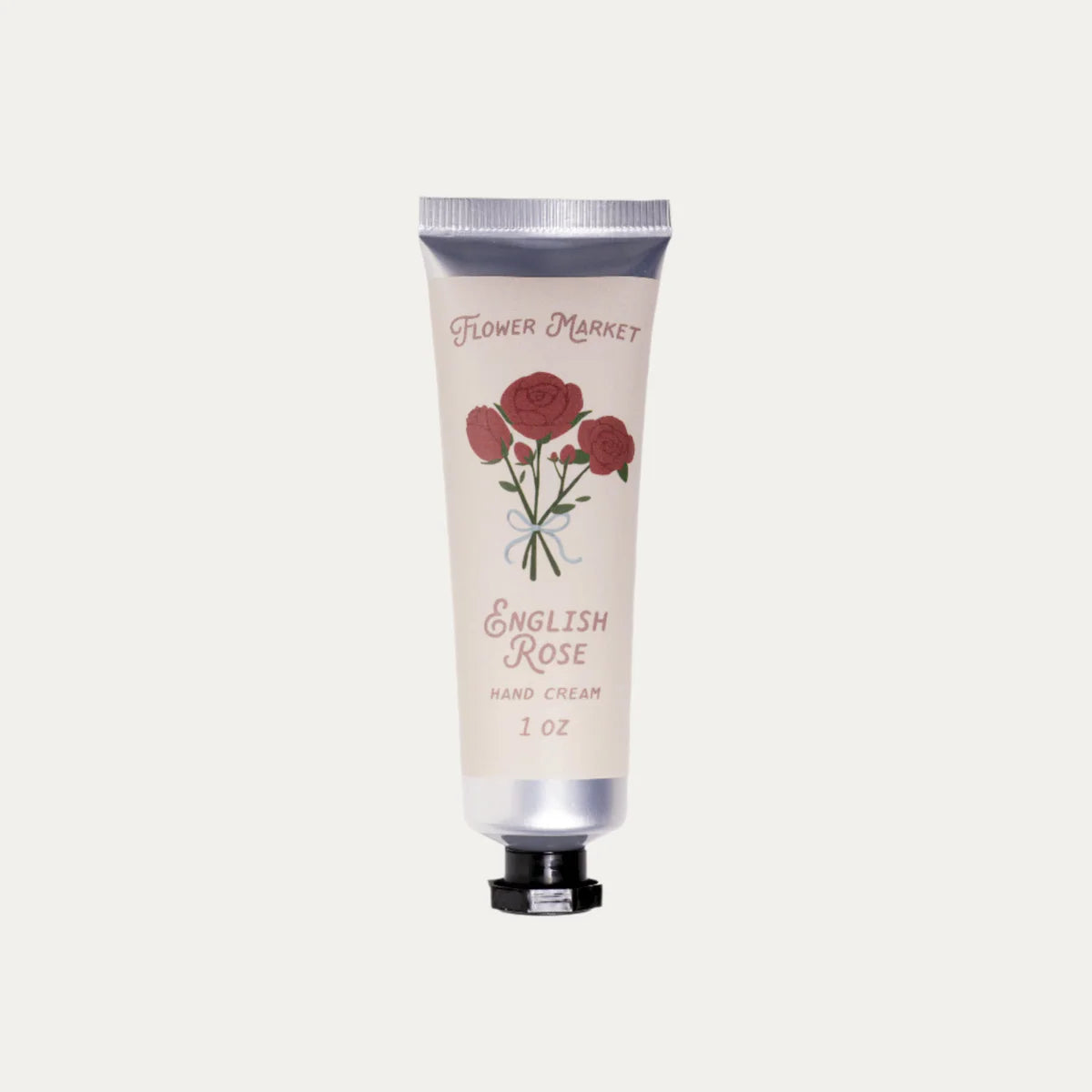 Hand cream tube labeled 'English Rose' with floral design on a light gray background
