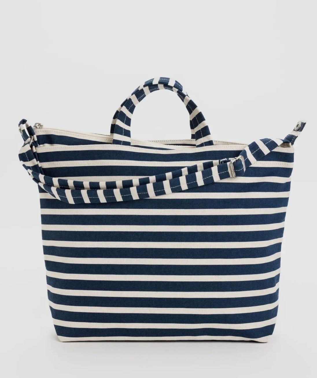 Navy and white striped tote bag on a light gray background