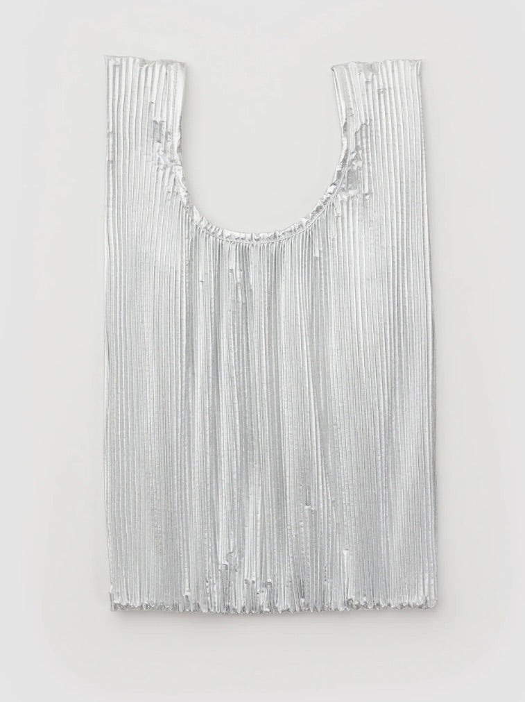 Silver pleated bag on a light gray background