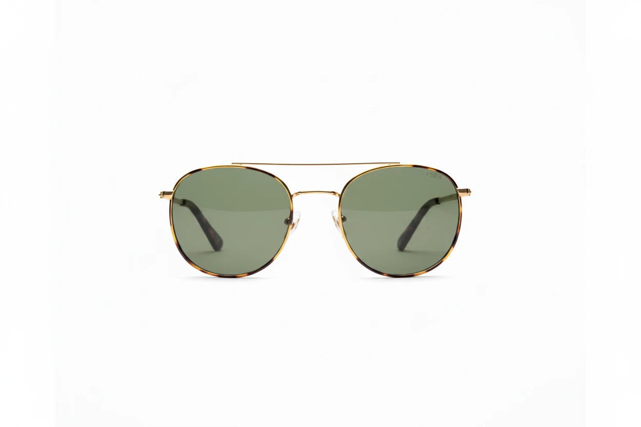 Round sunglasses with gold frame and green lenses on a white background
