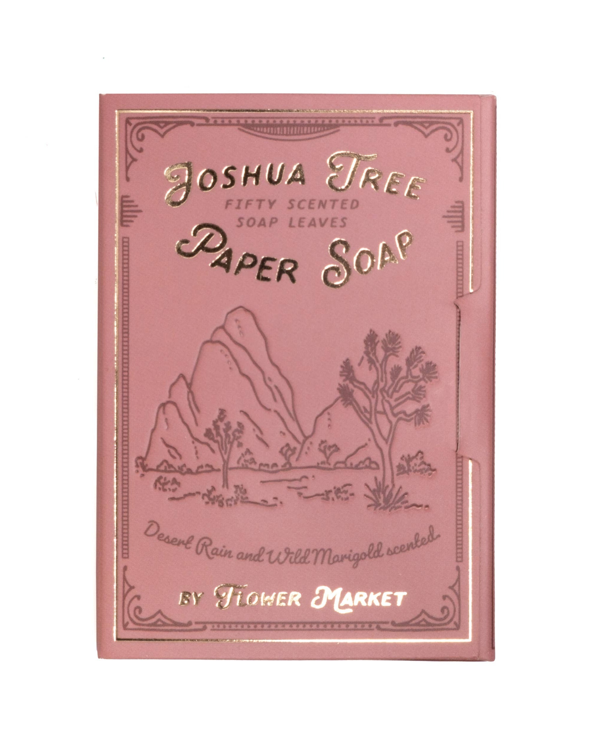 Pink packaging of Joshua Tree Paper Soap with desert-themed illustration on a white background