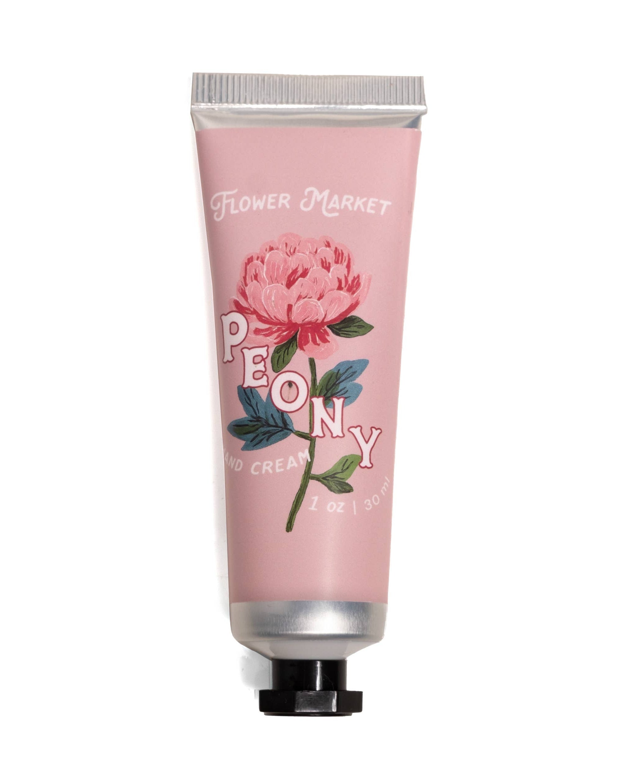 Hand cream tube with pink packaging and floral design on a white background