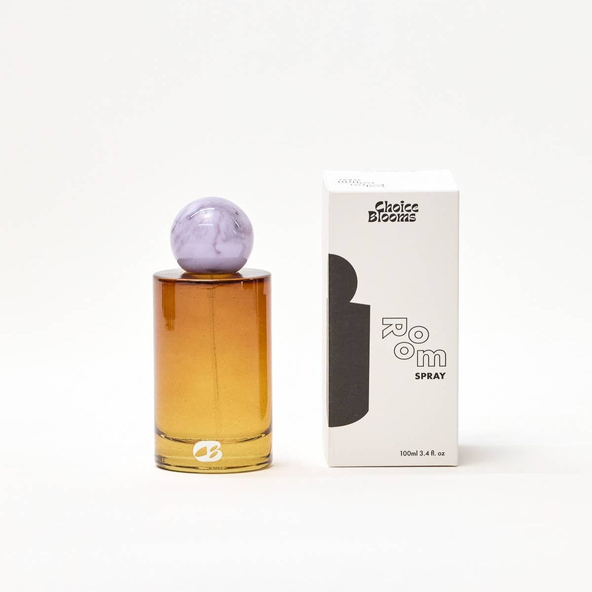 Perfume bottle with purple cap and packaging on a white background