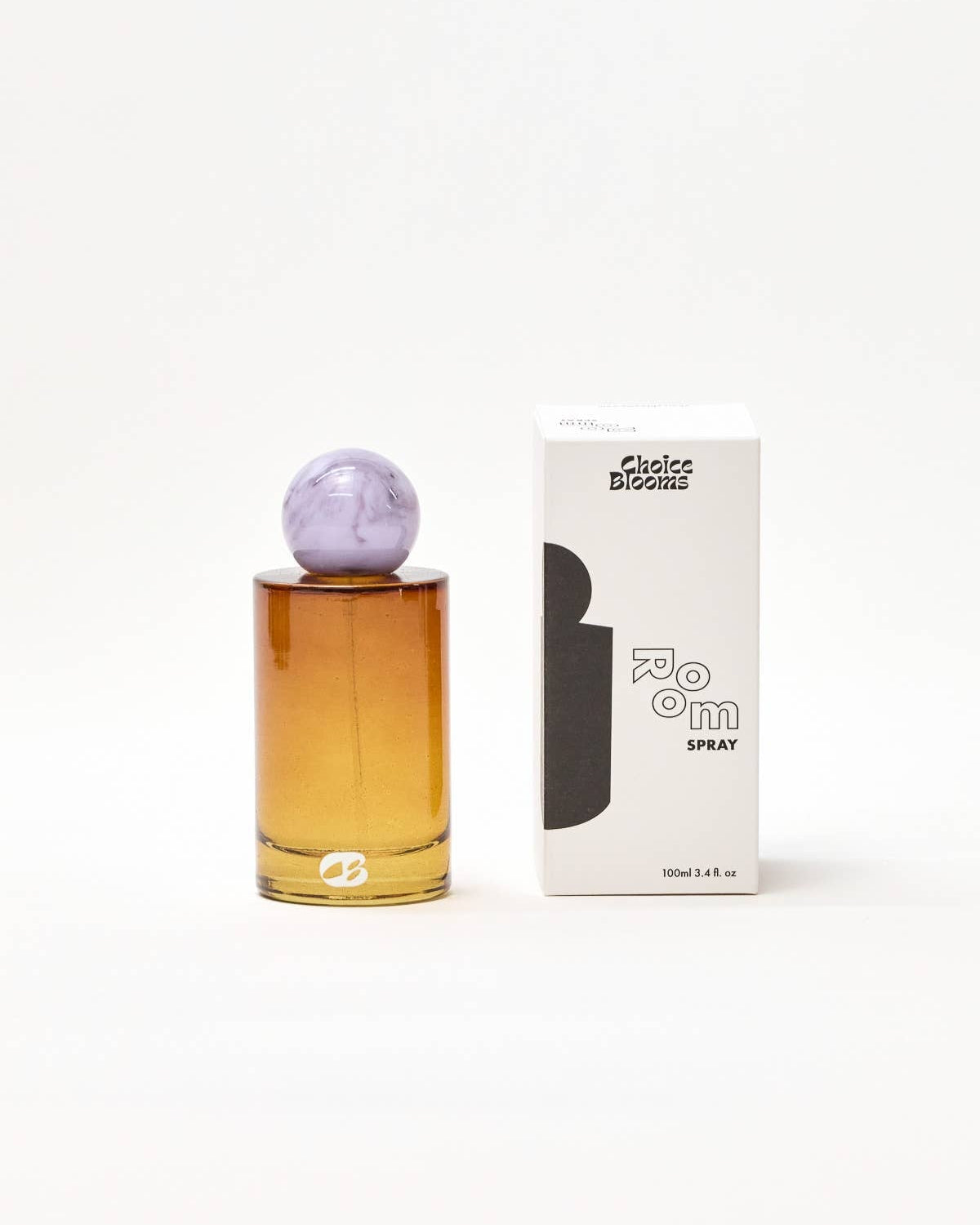 Perfume bottle with purple cap and packaging on a white background