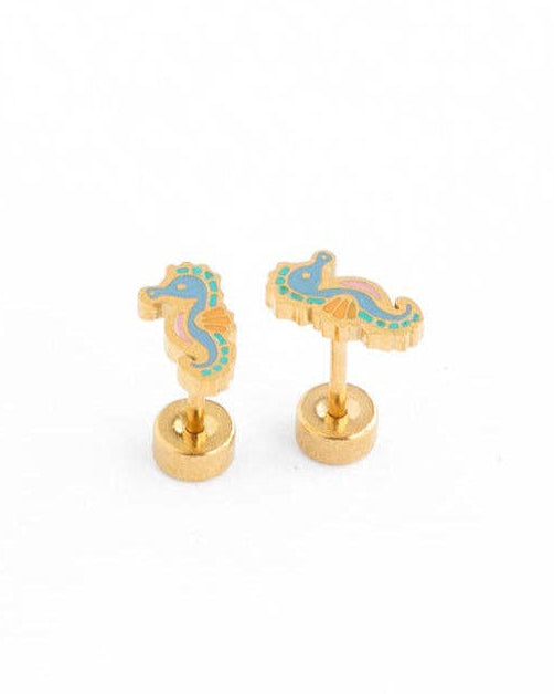 Gold and blue seahorse-shaped earrings on a white background